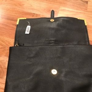 Never used black clutch